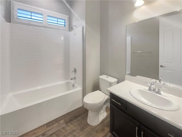 full bathroom featuring shower / tub combination, toilet, vanity, and hardwood / wood-style flooring