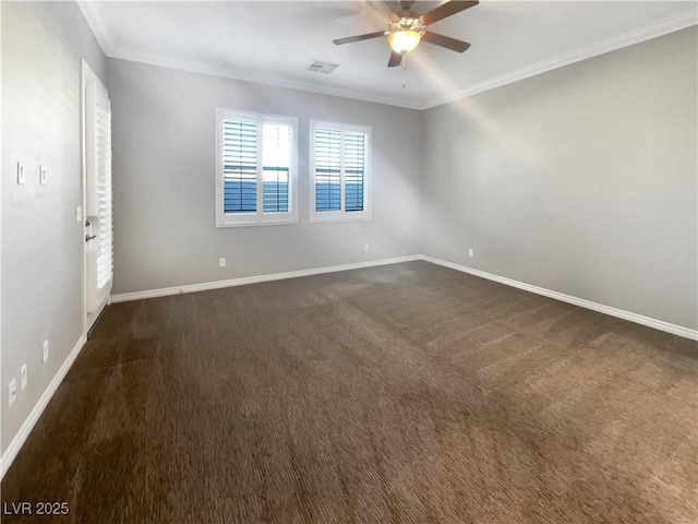 unfurnished room with ceiling fan, dark carpet, and ornamental molding