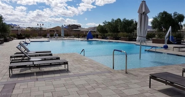 view of swimming pool featuring a patio