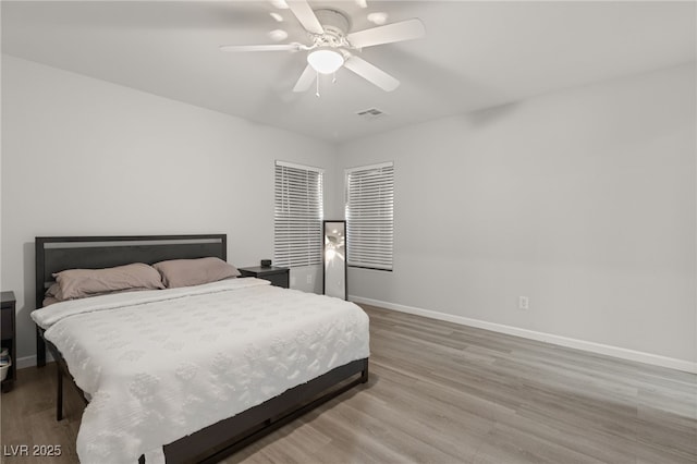 bedroom featuring hardwood / wood-style floors and ceiling fan