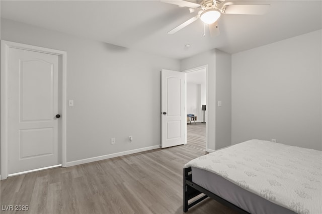 bedroom with ceiling fan and light hardwood / wood-style floors