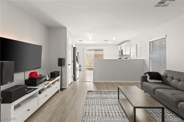 living room featuring light wood-type flooring