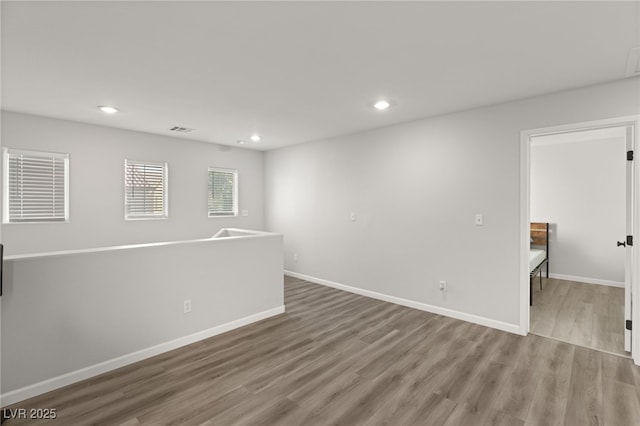 unfurnished room featuring light hardwood / wood-style floors