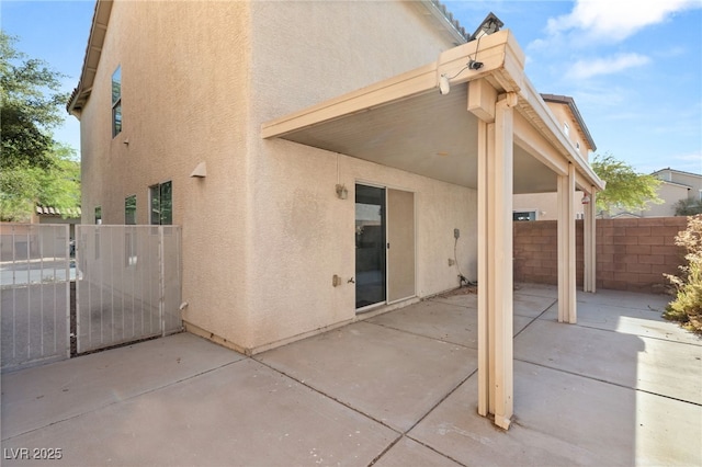 rear view of house with a patio