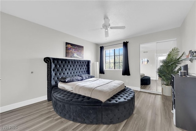 bedroom featuring hardwood / wood-style floors and ceiling fan