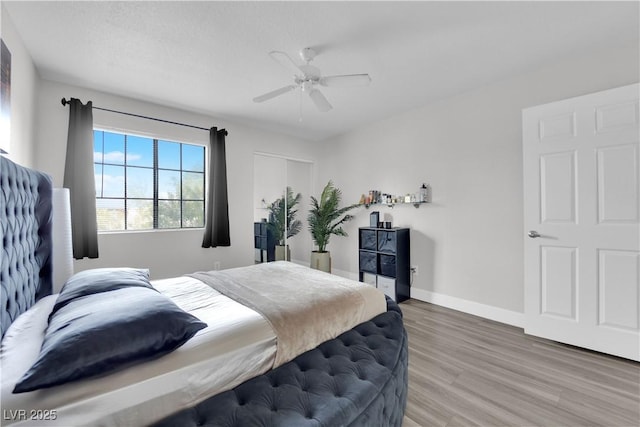 bedroom with hardwood / wood-style flooring and ceiling fan