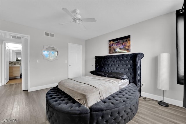 bedroom with hardwood / wood-style flooring and ceiling fan