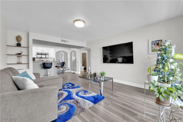 living room with light hardwood / wood-style floors