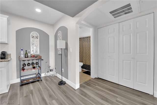 foyer entrance with light hardwood / wood-style flooring