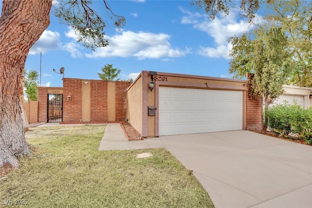 view of front of home featuring a garage and a front yard