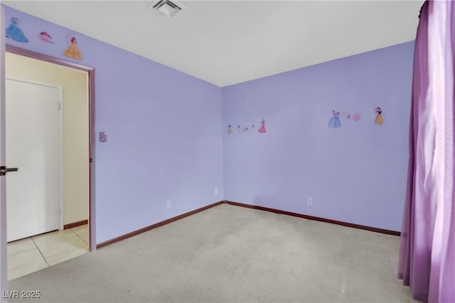 unfurnished room with light tile patterned floors