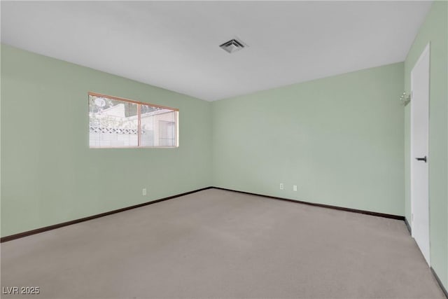 unfurnished room with light carpet