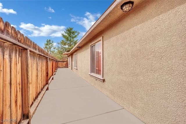 view of side of property featuring a patio