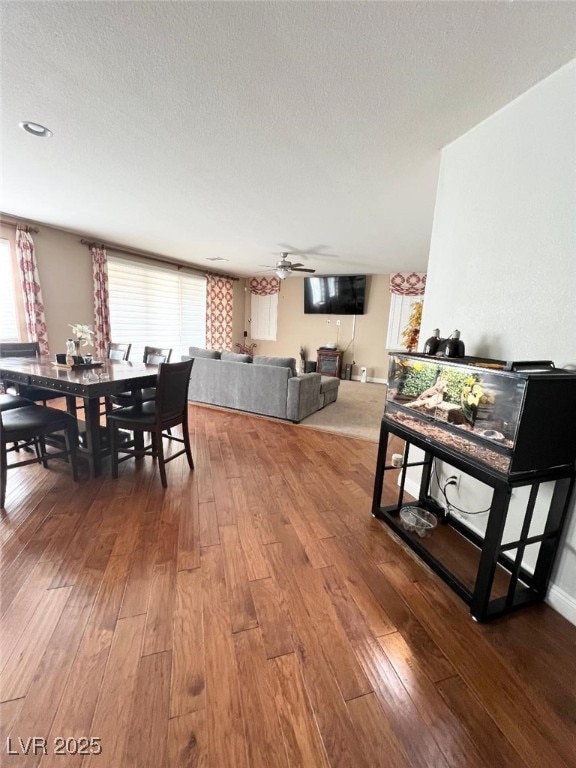 dining room with ceiling fan, hardwood / wood-style floors, and a wealth of natural light