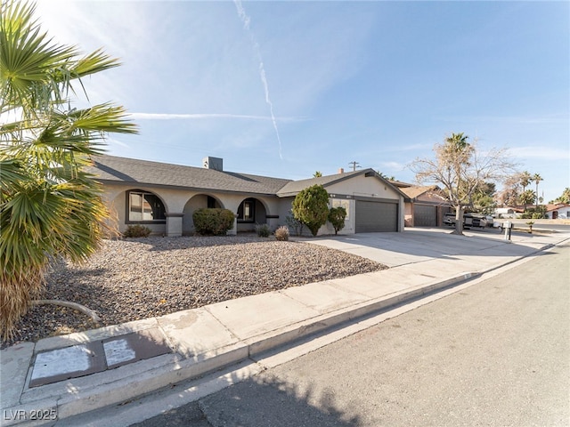 single story home featuring a garage