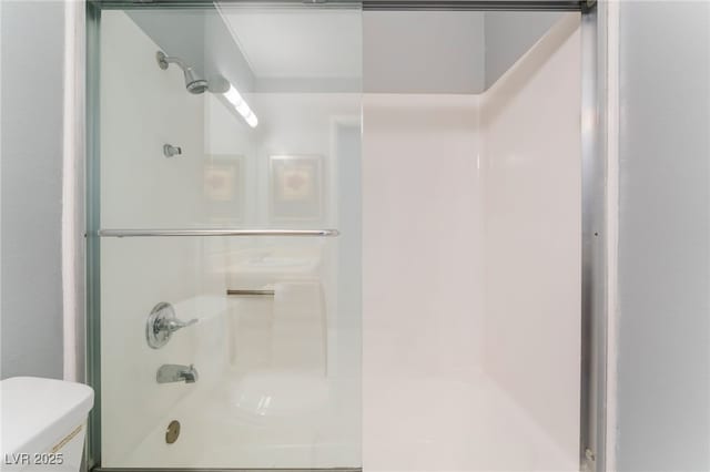 bathroom with toilet and shower / bath combination