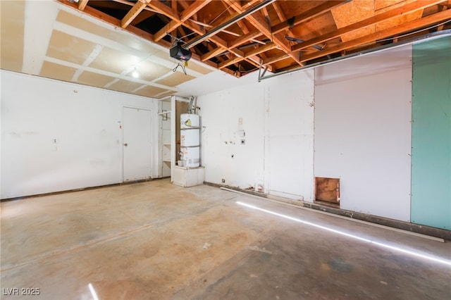 garage featuring secured water heater and a garage door opener