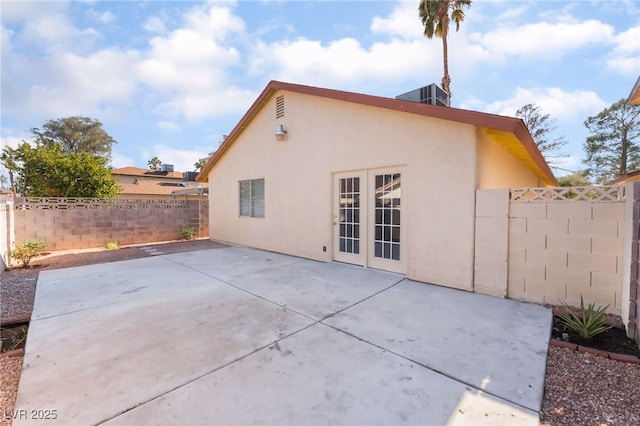 back of house with french doors and a patio