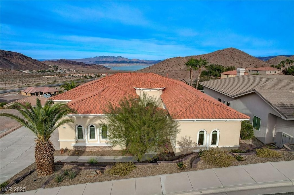 view of front of property with a mountain view