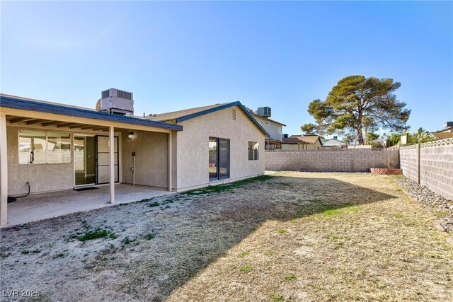 back of house with cooling unit and a patio area