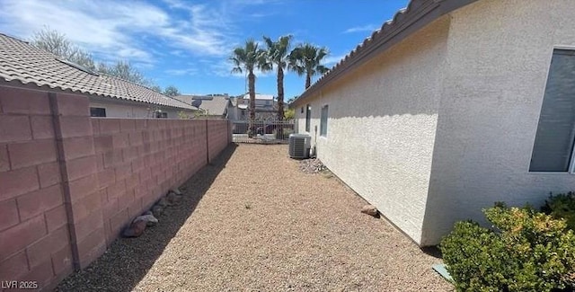 view of side of home featuring cooling unit