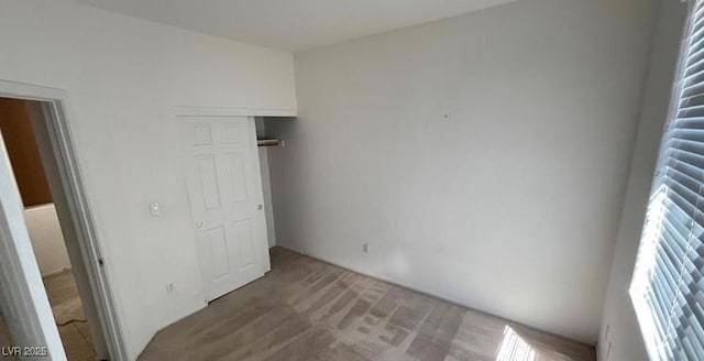 unfurnished bedroom featuring carpet flooring