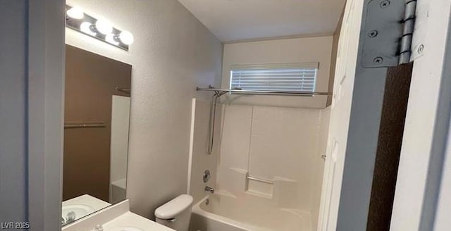 full bathroom featuring shower / tub combination, vanity, and toilet