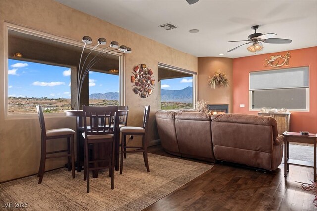 dining room featuring dark hardwood / wood-style floors and ceiling fan