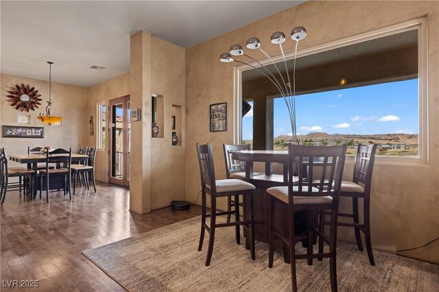 dining area featuring hardwood / wood-style flooring