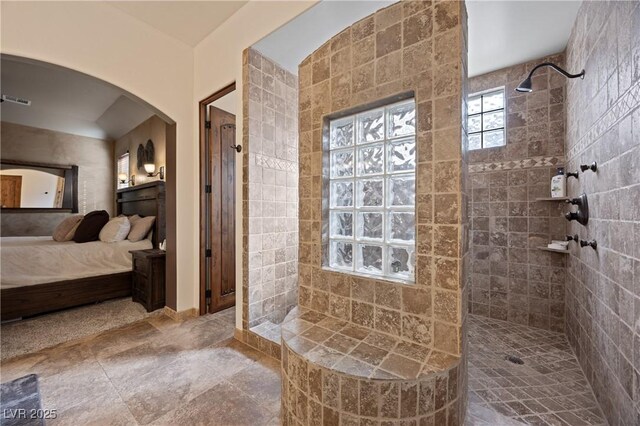 bathroom featuring a tile shower