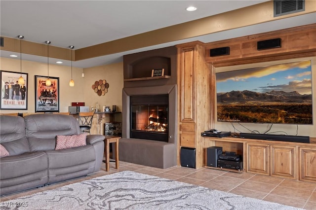 tiled living room featuring a fireplace