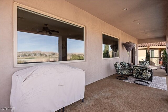 view of patio / terrace with ceiling fan