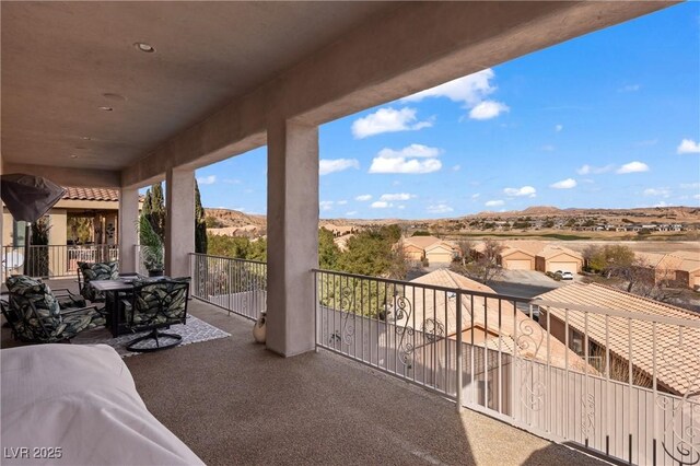 balcony featuring a mountain view