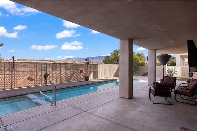 view of pool with a patio area and a hot tub