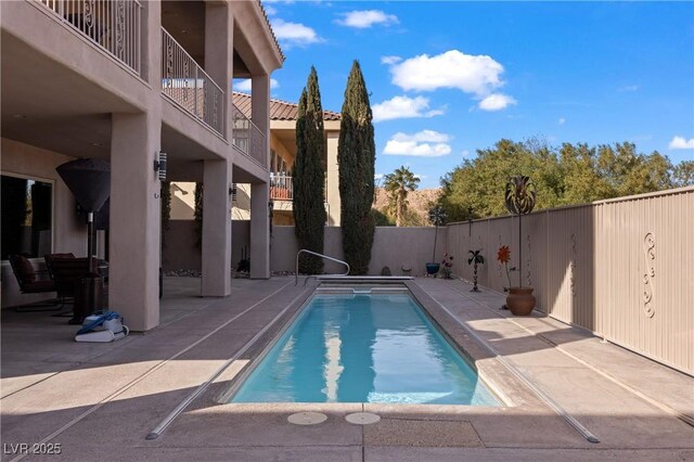 view of pool featuring a patio