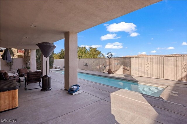 view of swimming pool featuring a patio