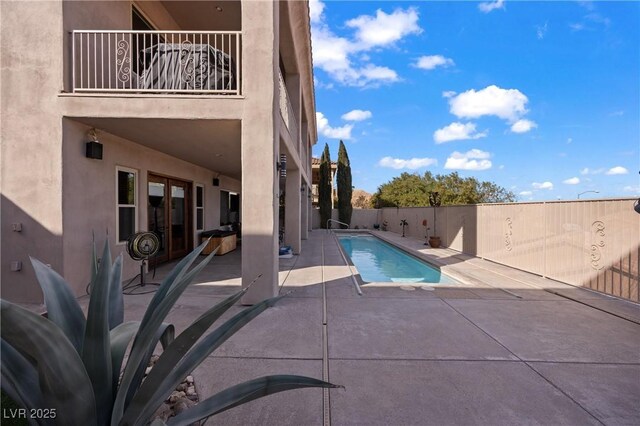 view of pool featuring a patio area