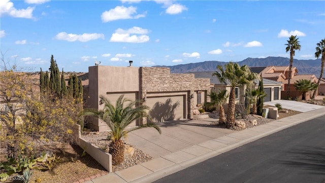 view of front of house with a mountain view and a garage