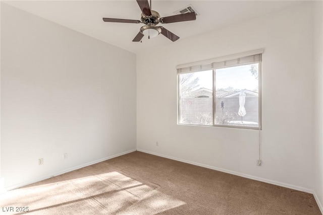 unfurnished room featuring ceiling fan and light colored carpet