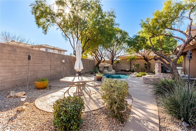 exterior space with a fenced in pool