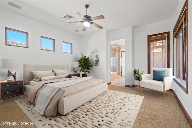 bedroom featuring light carpet, connected bathroom, visible vents, and baseboards