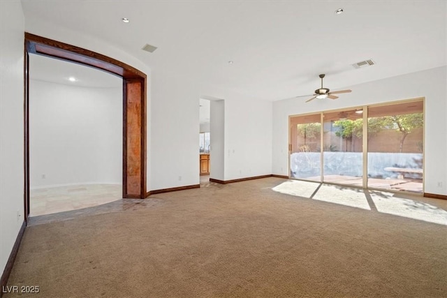 unfurnished living room with a ceiling fan, carpet flooring, visible vents, and baseboards