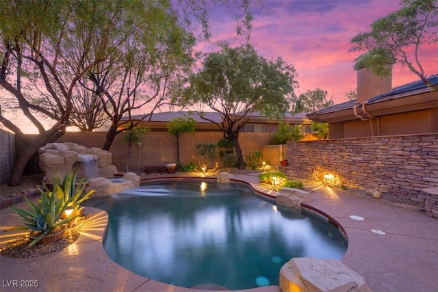 view of swimming pool featuring a fenced backyard and a fenced in pool