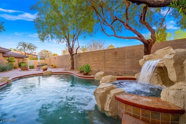 view of swimming pool featuring a fenced backyard, a fenced in pool, and a patio