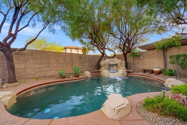 view of swimming pool featuring a fenced backyard and a fenced in pool