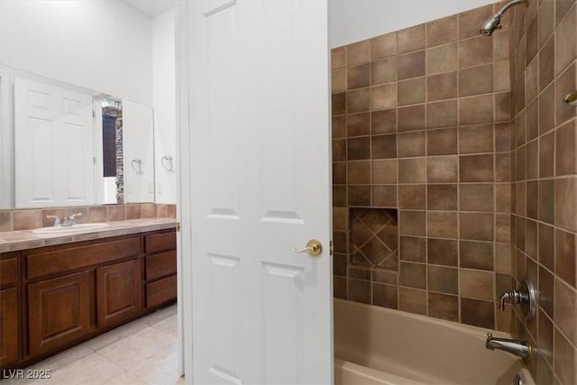 full bath featuring  shower combination, tile patterned flooring, and vanity