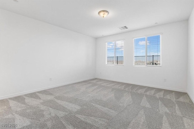 empty room featuring carpet flooring