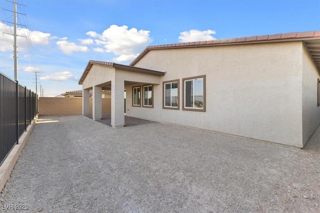 rear view of house with a patio