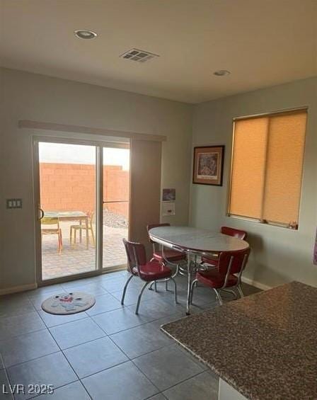 dining room with tile patterned flooring