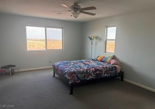 bedroom with ceiling fan and carpet floors